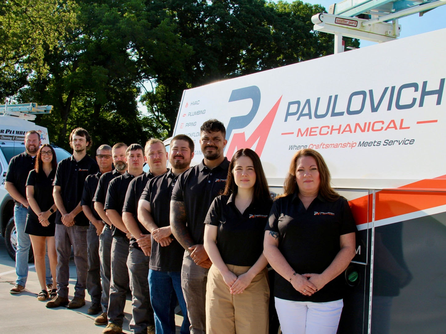Paulovich Mechanical branded service truck with staff